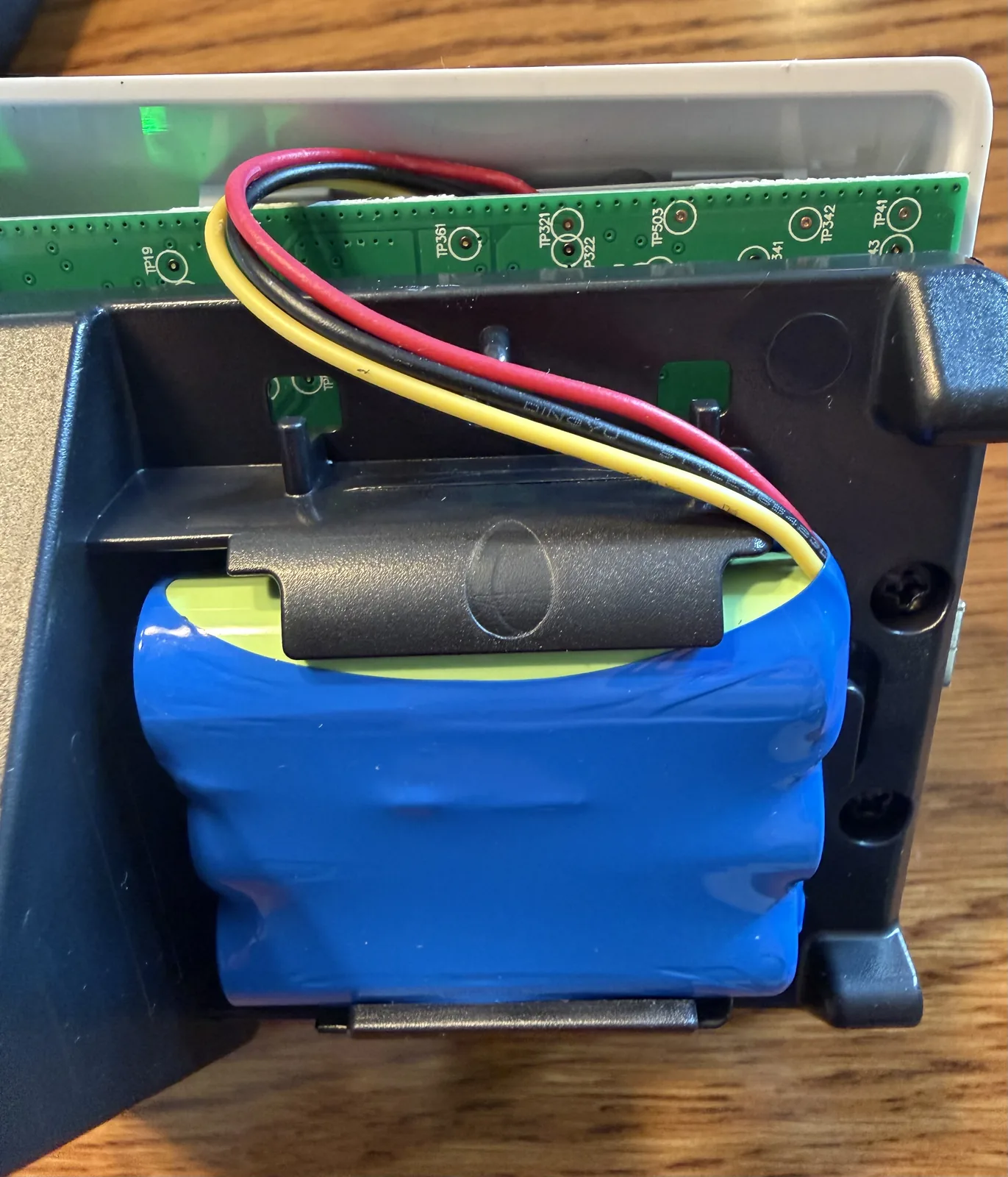 Another side view showing how the battery wire routes to the jumper