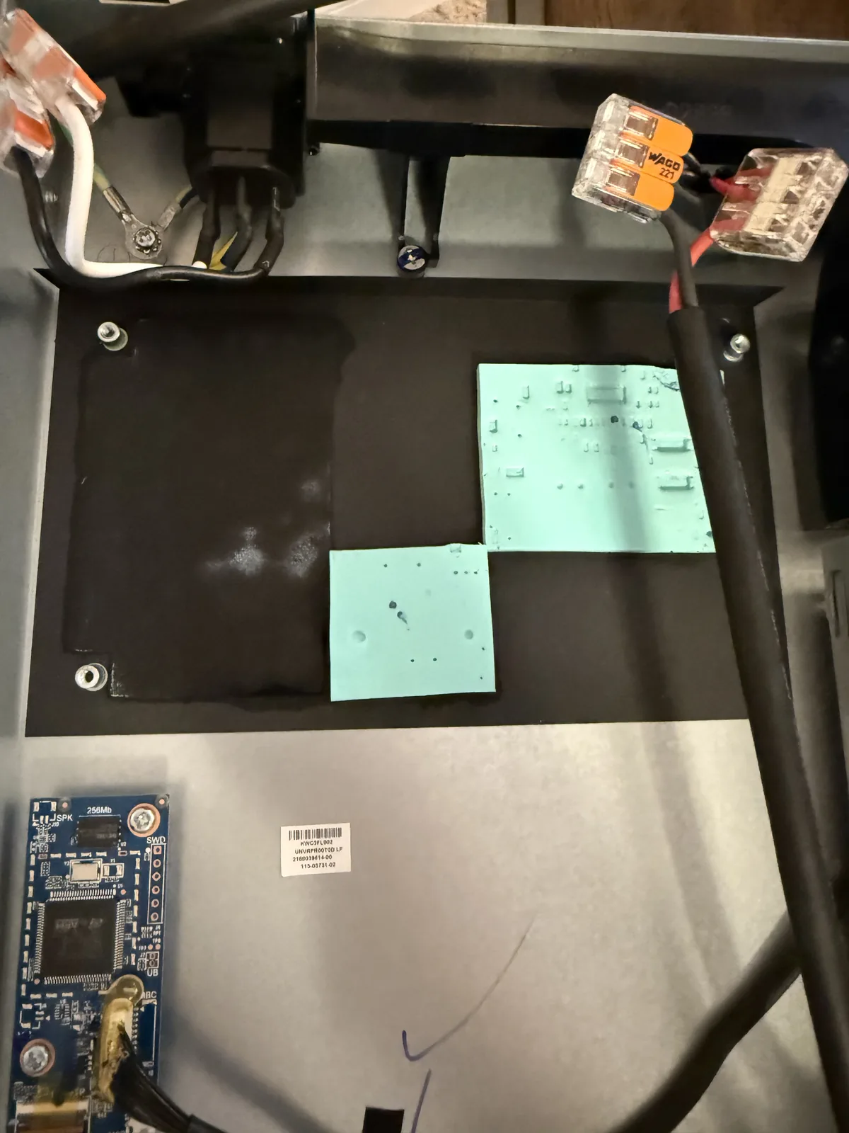 The old power supply removed from the UDM SE